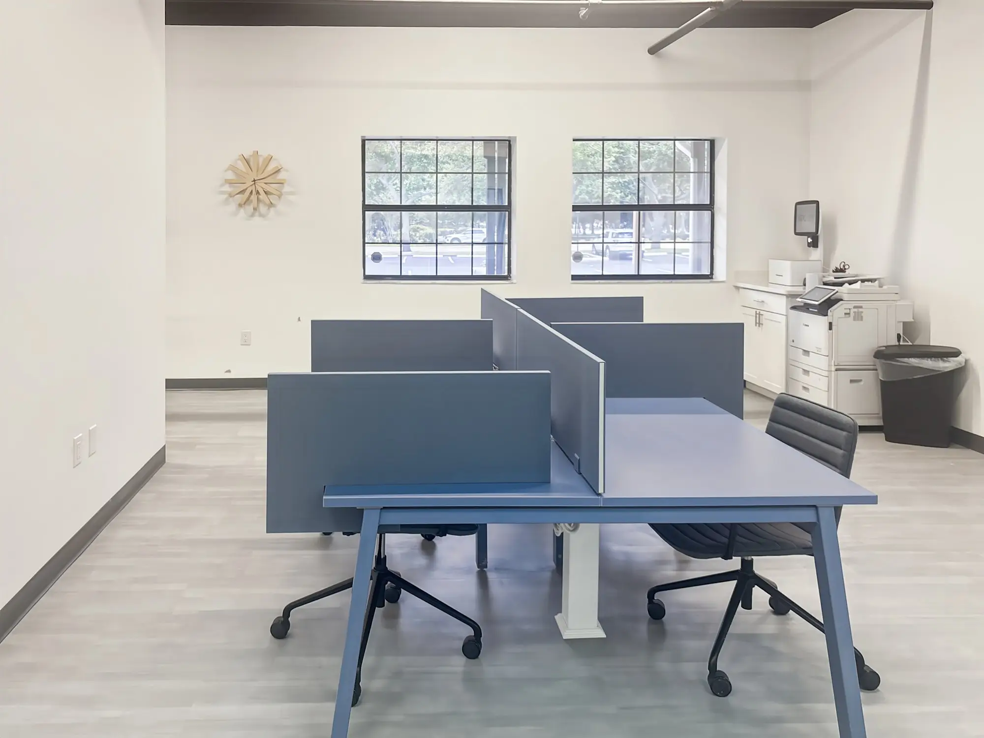 Coworking desks by the windows at Regus Central Park Largo